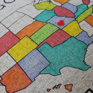 Upclose photo of the pillow sham to show the texture of the faux linen fabric. The beautiful fabric shows through the colors to create a really fun textured look. The detailed photo shows some states colored in with bright colored markers.