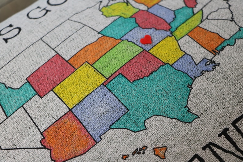 Upclose photo of the pillow sham to show the texture of the faux linen fabric. The beautiful fabric shows through the colors to create a really fun textured look. The detailed photo shows some states colored in with bright colored markers.