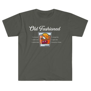 May include: A dark gray t-shirt with the text "Old Fashioned" and a graphic of an old fashioned cocktail with the ingredients listed below: 2 oz brandy, 1 splash soda, 2 dashes bitters, 1 orange slice, 1 sugar cube, 2 maraschino cherries.