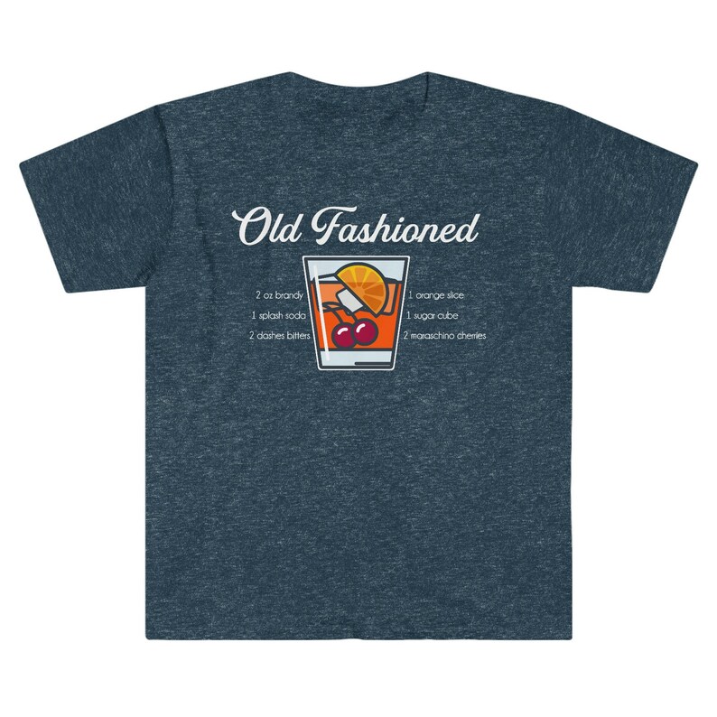 May include: A dark blue t-shirt with a white graphic of an Old Fashioned cocktail recipe. The graphic includes a glass of the cocktail with an orange slice, cherries, and a sugar cube. The text reads "Old Fashioned" and lists the ingredients: 2 oz brandy, 1 splash soda, 2 dashes bitters, 1 orange slice, 1 sugar cube, 2 maraschino cherries.