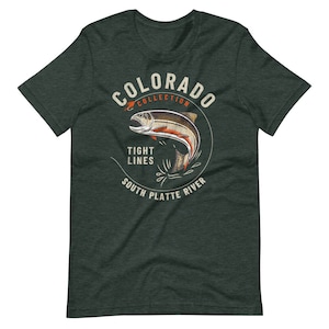 May include: A green t-shirt with a vintage-style illustration of a trout jumping out of the water. The illustration is surrounded by a circle with the text "Colorado Collection", "Tight Lines", and "South Platte River".