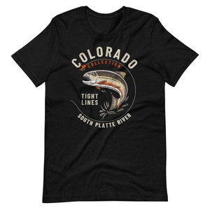 May include: Black t-shirt with a white circle graphic featuring a trout jumping out of the water. The circle graphic says "Colorado Collection", "Tight Lines", and "South Platte River".