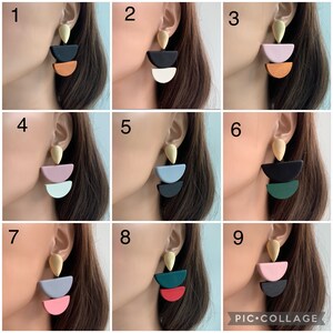 May include: Nine pairs of geometric earrings with a teardrop-shaped top and three semi-circle shapes. The earrings are in various colors, including black, white, pink, blue, green, red, and brown.