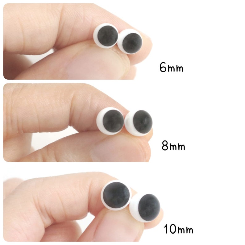 May include: A set of round, white plastic craft eyes with black pupils, displayed in three different sizes labelled as 6mm, 8mm, and 10mm. Each pair of eyes features a smooth, spherical surface and a high-contrast design for use in various projects.