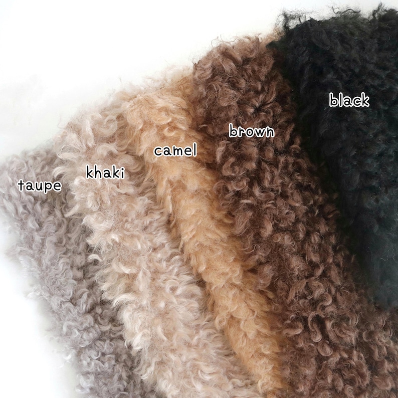 May include: Close-up of various faux fur swatches in shades of taupe, khaki, camel, brown, and black. The textures are curly and soft, with the color names labeled on the fabric.