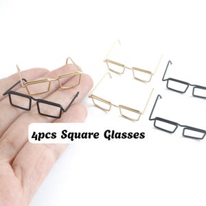 May include: A set of 4pcs Square Glasses featuring miniature wire frames in black and gold finishes. The collection includes two pairs of black square glasses and two pairs of gold square glasses, all designed with thin metal wire construction.