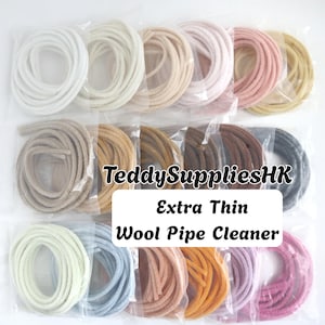 May include: A collection of extra thin wool pipe cleaners in various colors, each coiled and individually packaged in clear plastic sleeves. The text TeddySuppliesHK Extra Thin Wool Pipe Cleaner is overlaid in the center of the image.