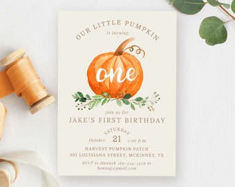 May include: A cream-colored invitation with a watercolor pumpkin design. The text reads "Our Little Pumpkin is turning one" and invites guests to Jake's first birthday on October 21st at the Harvest Pumpkin Patch. Includes RSVP information.