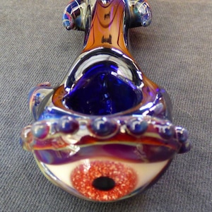 Promo Pipe, 30% off Handblown in the U.S boro / pyrex red eye with white fleck glass pipe cobalt with amber purple eyelid and horns demon