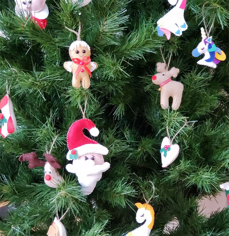 This 100/% handmade adorable felt Christmas tree with star prints is the perfect addition to your Christmas tree ornaments.