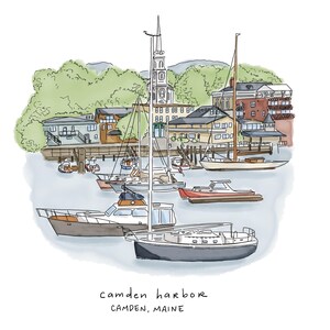 May include: Watercolor illustration of Camden Harbor, Maine, featuring boats, buildings, and a church steeple. The image includes the text "camden harbor" and "CAMDEN, MAINE" in a handwritten style. The scene is set against a backdrop of green hills.