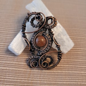 Goldstone bead pendant in antiqued copper