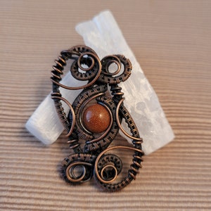 Goldstone bead pendant in antiqued copper
