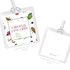 May include: Two white laminated bag tags. The front tag features a white background with a pattern of colorful insects. The text "CHARLIE EDWARDS" is inside a green square. The back tag is white with the text "shoe fly" and "LAMINATED BAG TAG BACK".