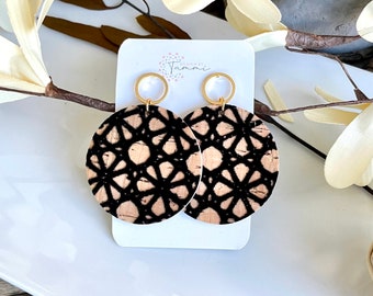 Natural cork with gold flecks with a raised black print circle leather earrings
