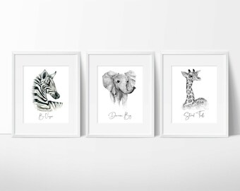 May include: Three black and white animal illustrations in white frames. The first image is a zebra with the text "Be Unique". The second image is an elephant with the text "Dream Big". The third image is a giraffe with the text "Stand Tall".