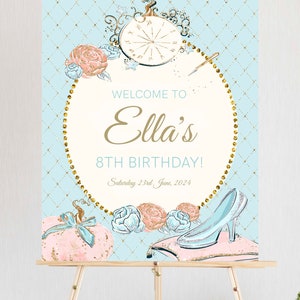 May include: A blue and gold welcome sign with a Cinderella theme. The sign says "Welcome to Ella's 8th Birthday! Saturday 23rd June, 2024".
