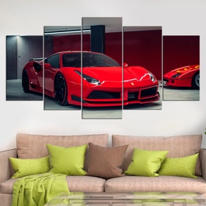 May include: A red Ferrari sports car in a garage setting. The car is in focus and the background is blurred. The car has a black interior and black wheels. The car is parked in a garage with a red wall and a black floor.