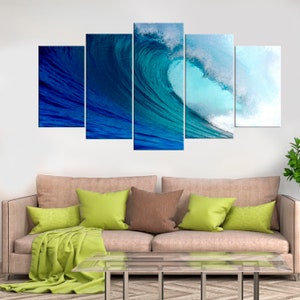 May include: A five-piece canvas print set featuring a large, crashing ocean wave with shades of blue and white. The wave is captured in a dynamic pose, creating a sense of movement and energy.