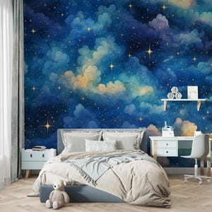 May include: A bedroom with a celestial theme. The focal point is a wall mural depicting a night sky with clouds and stars. The room includes a bed with pillows and a desk with a chair, creating a dreamy and inviting space.