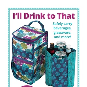 May include: A blue and purple floral patterned insulated tote bag with a zippered closure and a shoulder strap. The bag is designed to safely carry beverages, glassware, and other fragile items. The text "I'll Drink to That" is at the top of the image. The text "Includes coupon for $5 Add-On Video Tutorial" is in a circle at the bottom left of the image. The text "byannie.com ... what's in your bag?" is at the bottom center of the image. The text "Collapsible padded inner divider cushions fragile contents" is at the bottom right of the image.