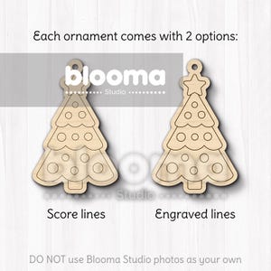 May include: Two wooden Christmas tree ornaments. One has score lines, the other has engraved lines. Each tree has a star or a loop at the top and circular cutouts. The text says "Each ornament comes with 2 options: Score lines, Engraved lines."