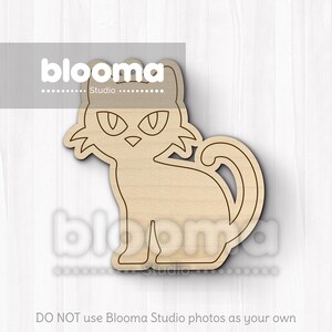 May include: A wooden cat-shaped cutout with a stylized design. The cat is sitting with its tail curled and has large, pointed ears and eyes. The cutout is made of light-colored wood and is suitable for crafts.