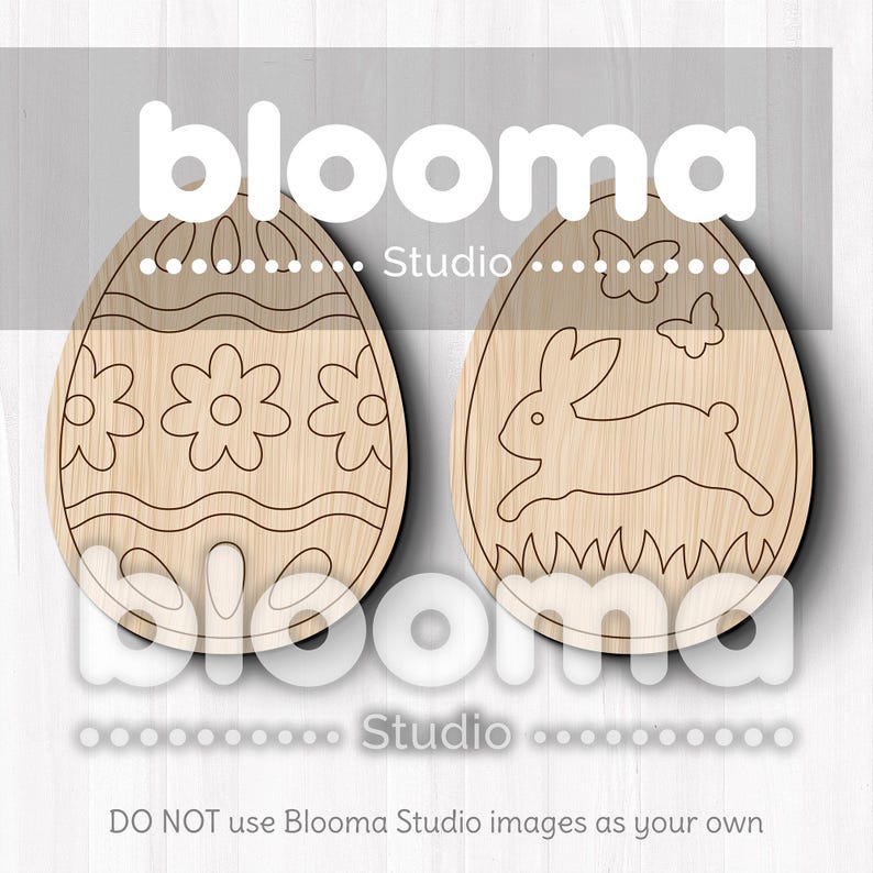May include: Two wooden Easter egg shapes, one with a floral design and the other with a bunny rabbit design. The eggs are unfinished and ready to be painted.