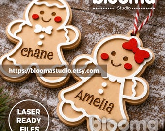 May include: Two wooden gingerbread person ornaments with white trim, red cheeks, and red and white twine hangers. One ornament features a white bow tie and the name Chane, while the other features a red hair bow and the name Amelia engraved on them.