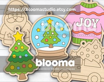 May include: Wooden Christmas-themed cut files, including a Santa, Christmas tree, snow globe, sweater with "JOY" text, and a car with a tree. The image includes the text "blooma Studio" and "https://bloomastudio.etsy.com".