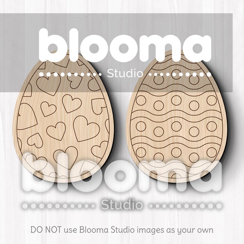 May include: Two wooden Easter egg cutouts, one with a heart pattern and the other with a wavy line and circle pattern. The text "blooma Studio" is printed on the image.
