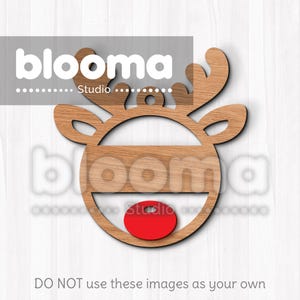May include: Wooden reindeer ornament with a red nose and a blank space for personalization. The ornament is made of natural wood and has a rustic look.