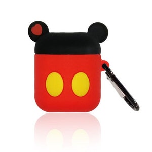 May include: Red and black AirPod case with a Mickey Mouse design. The case has two yellow circles and a black carabiner clip. The top of the case has two black ears, with a red heart on one ear.
