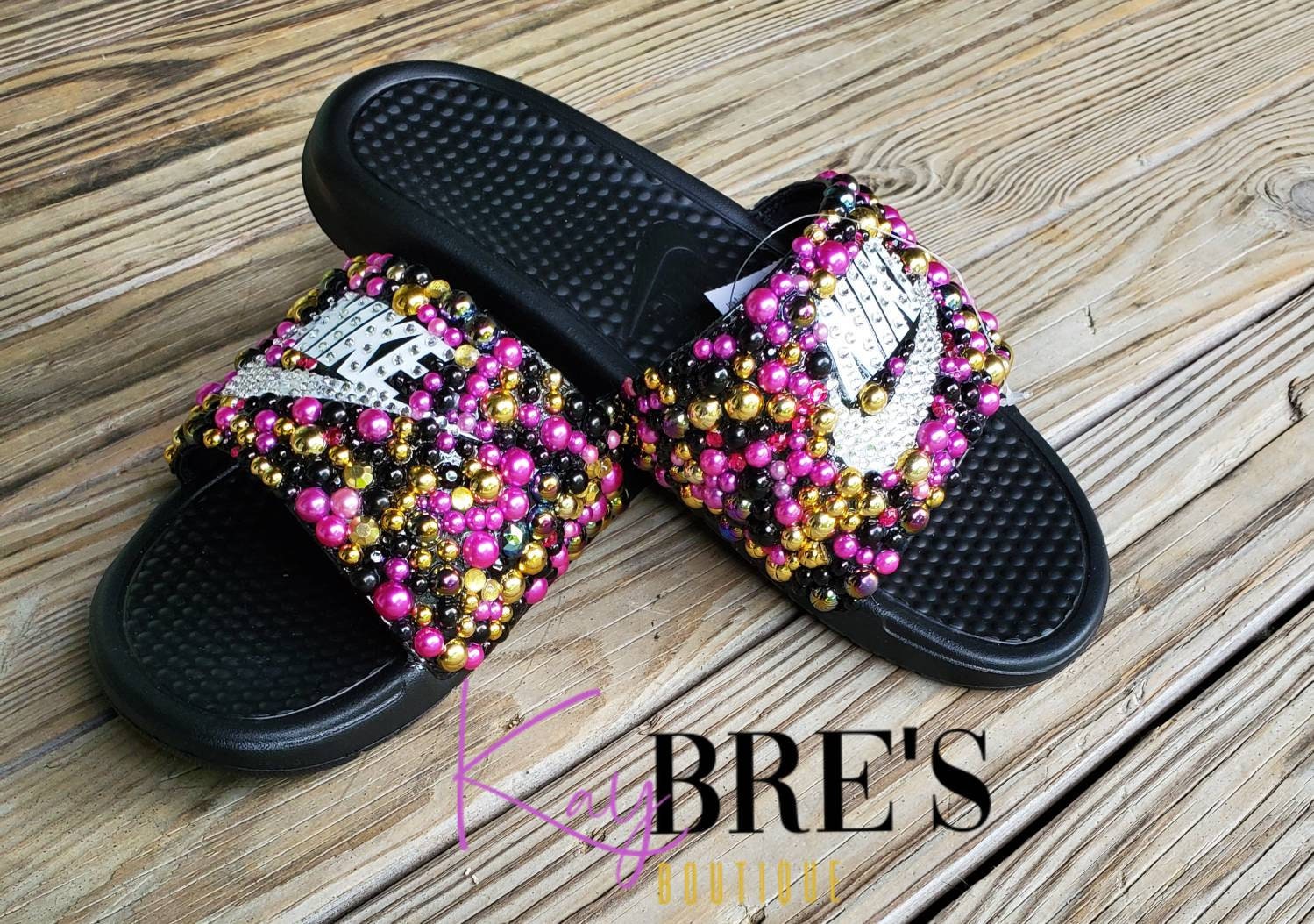 nike benassi slides gold swoosh