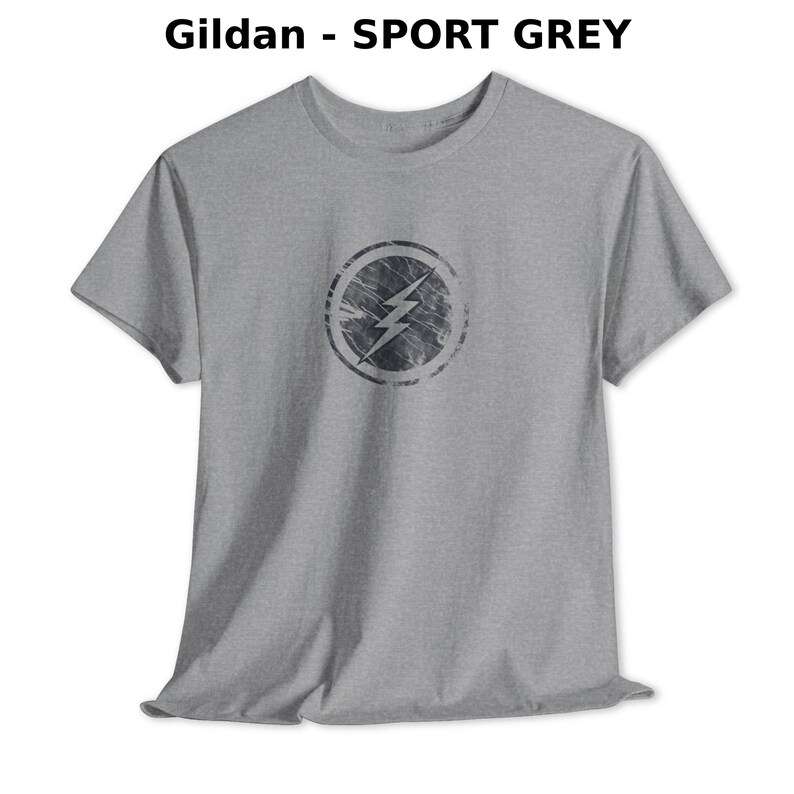 Distressed lightning bolt graphic t-shirt with circular emblem printed on ringer and classic cotton tees in multiple color options