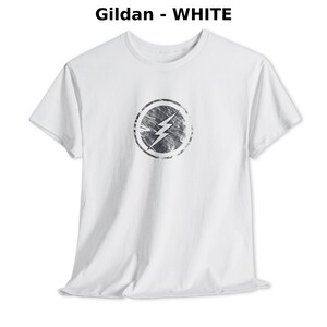 Distressed lightning bolt graphic t-shirt with circular emblem printed on ringer and classic cotton tees in multiple color options