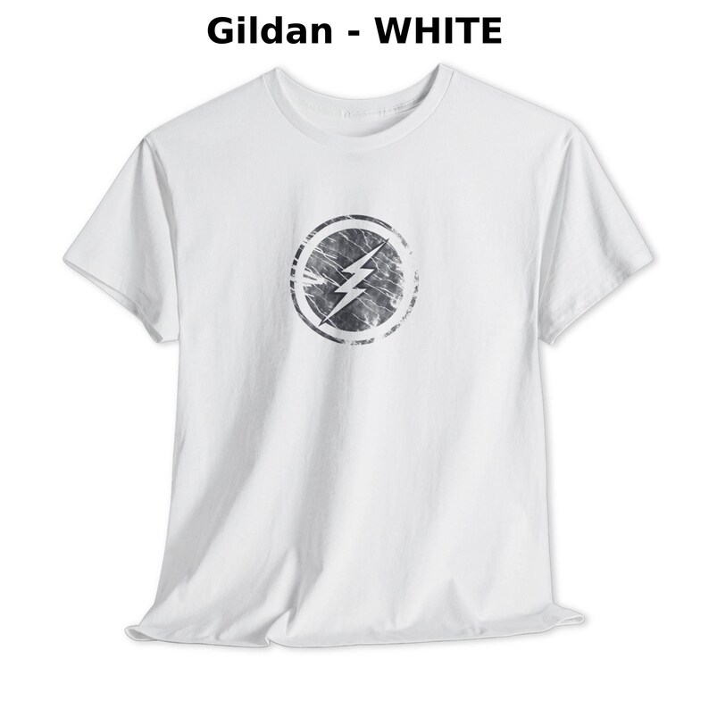 Distressed lightning bolt graphic t-shirt with circular emblem printed on ringer and classic cotton tees in multiple color options