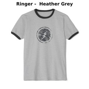 Distressed lightning bolt graphic t-shirt with circular emblem printed on ringer and classic cotton tees in multiple color options