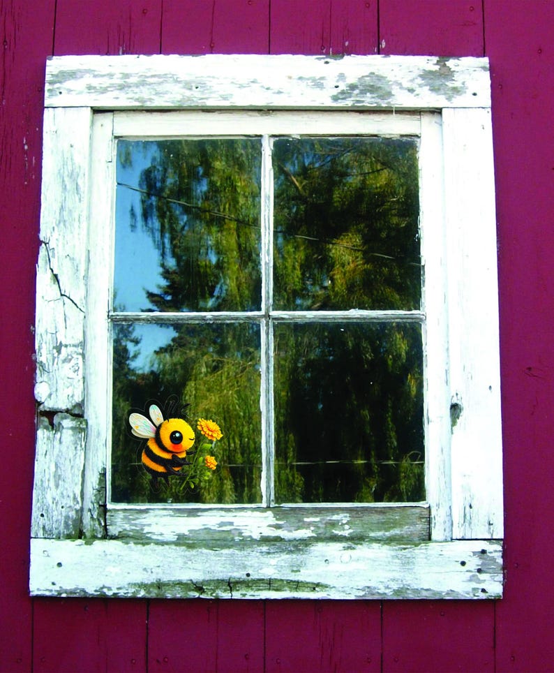 Adorable die-cut vinyl design of a fuzzy yellow honeybee holding a bright yellow flower. Shown as a fridge magnet displayed on a stainless steel refrigerator. This design is also available as a waterproof transparent sticker in five sizes. Ideal for decorating laptops, journals, water bottles, fridges, and more. Suitable for indoor and outdoor use.