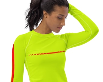 May include: A bright yellow long-sleeved shirt with red stripes on the sleeves and across the chest. The shirt is made of a stretchy, athletic material.