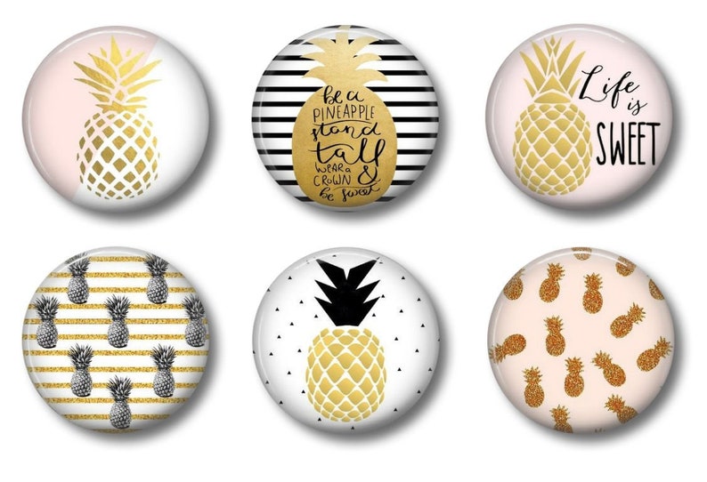 May include: Six round, white, gold, and black pineapple themed magnets. The magnets feature different designs, including a pineapple with a pink background, a pineapple with black and white stripes, a pineapple with black and white polka dots, a pineapple with a gold crown, and a pineapple with the text "Life is Sweet".