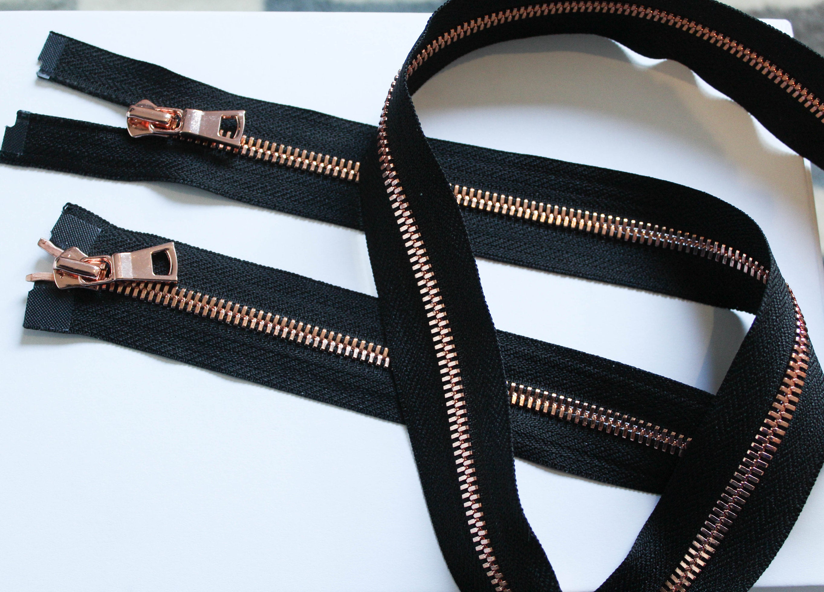 black jacket with rose gold zip