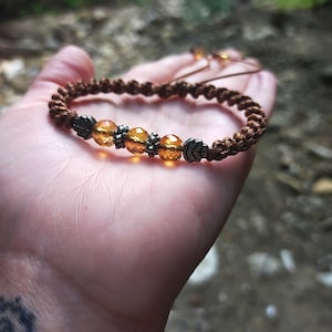 Braided bracelet made of cord and beads in boho style, Bracelet made of waxed cord and glass beads with ethnic style.