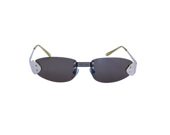 May include: Silver-toned sunglasses with brown lenses and a rounded shape.