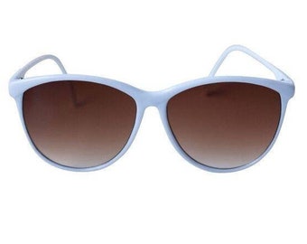 May include: White plastic sunglasses with brown gradient lenses.