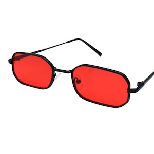 May include: Black-framed sunglasses with rectangular red lenses. The glasses have a sleek, modern design with a thin frame and straight temples. The lenses are a vibrant, solid red color, offering a bold look.
