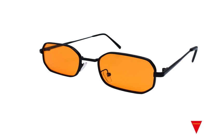 May include: Black rectangular frame sunglasses with orange lenses.