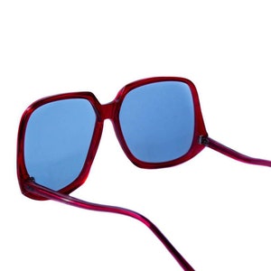 Original 1970s Beautiful Oversized Vintage Red Sunglasses, Metal reinforced frames with light dark level transitional lensed. This image 4