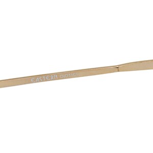 May include: A gold-colored metal frame for eyeglasses with the text "EASTERN OPTICS" printed on the arm.