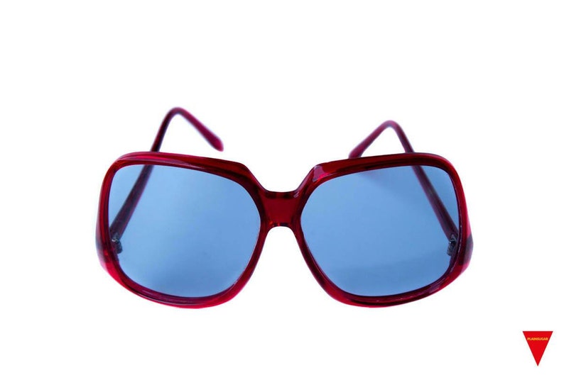 Original 1970s Beautiful Oversized Vintage Red Sunglasses, Metal reinforced frames with light dark level transitional lensed. This image 2